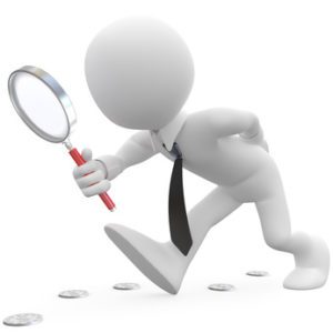 Businessman with magnifying glass looking for coins